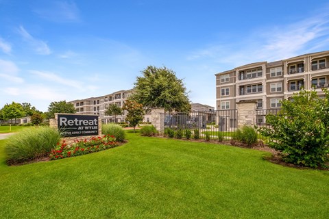 A sign that says Retreat is in front of a building.