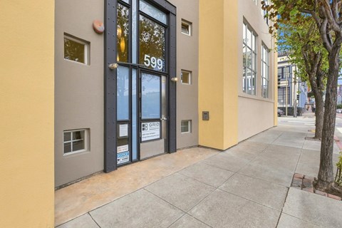 The image shows the front of a building with the number 599 on it.