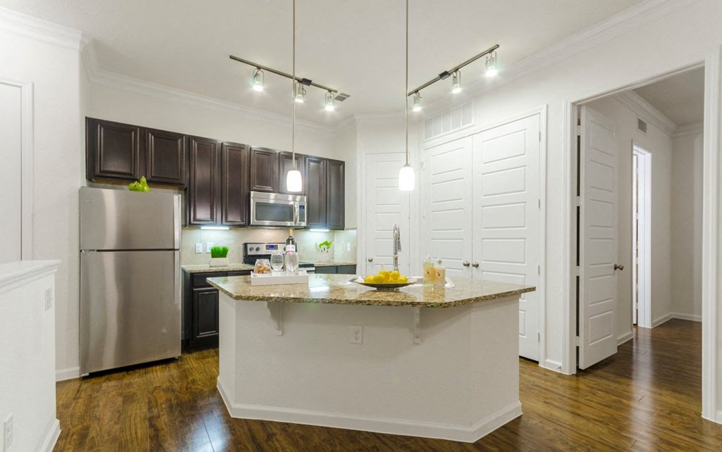 Kitchen area view with lights at Villages 3Eighty, Little Elm, 75068