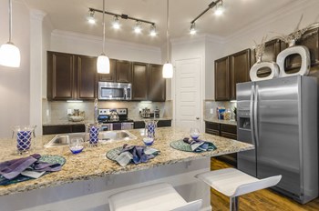 Kitchen counter table at Villages 3Eighty, Little Elm, Texas - Photo Gallery 10
