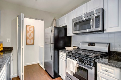 New Renovations, Upgraded Kitchens with Stainless Appliances, Washer Dryer & Modern White Cabinets at Ellington Metro West, Westborough, MA