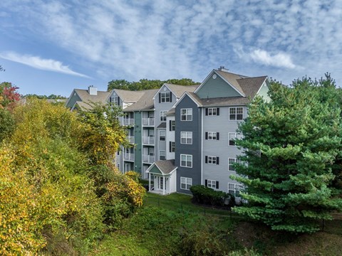 Ellington Metro West exterior building view with lush landscaping