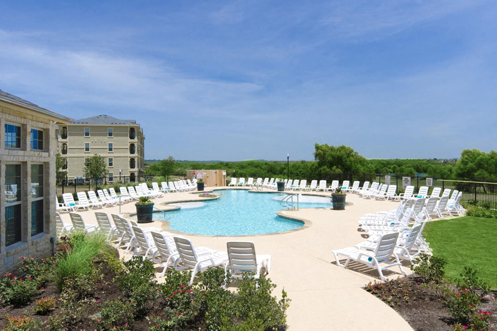 Pool Side Relaxing Area With Sundeck at Park at Briggs Ranch, Texas