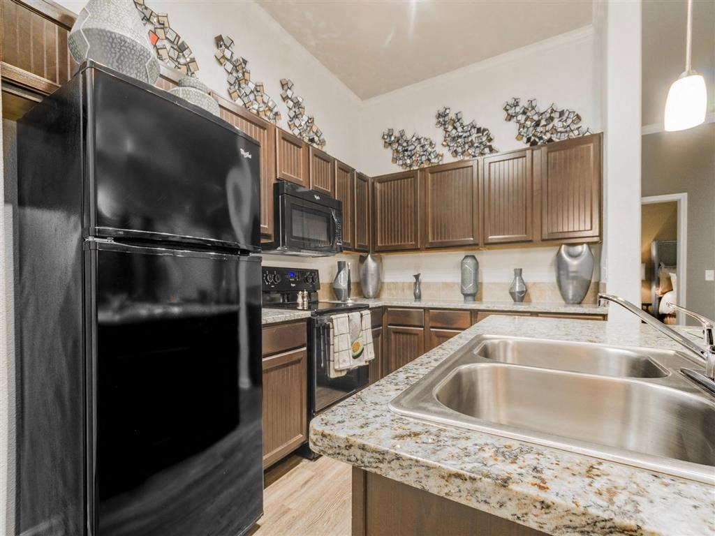 sink and refrigerator at Retreat at Magnolia, Texas, 77354