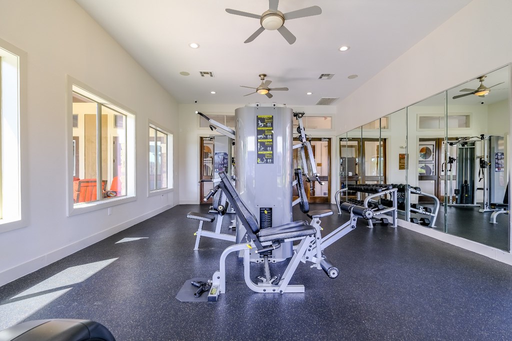 fitness center with cardio and strength training equipment at The Falls at Copper Lake apartments