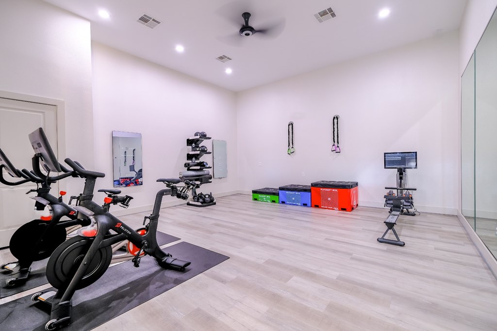 fitness center with flex space at The Falls at Copper Lake apartments