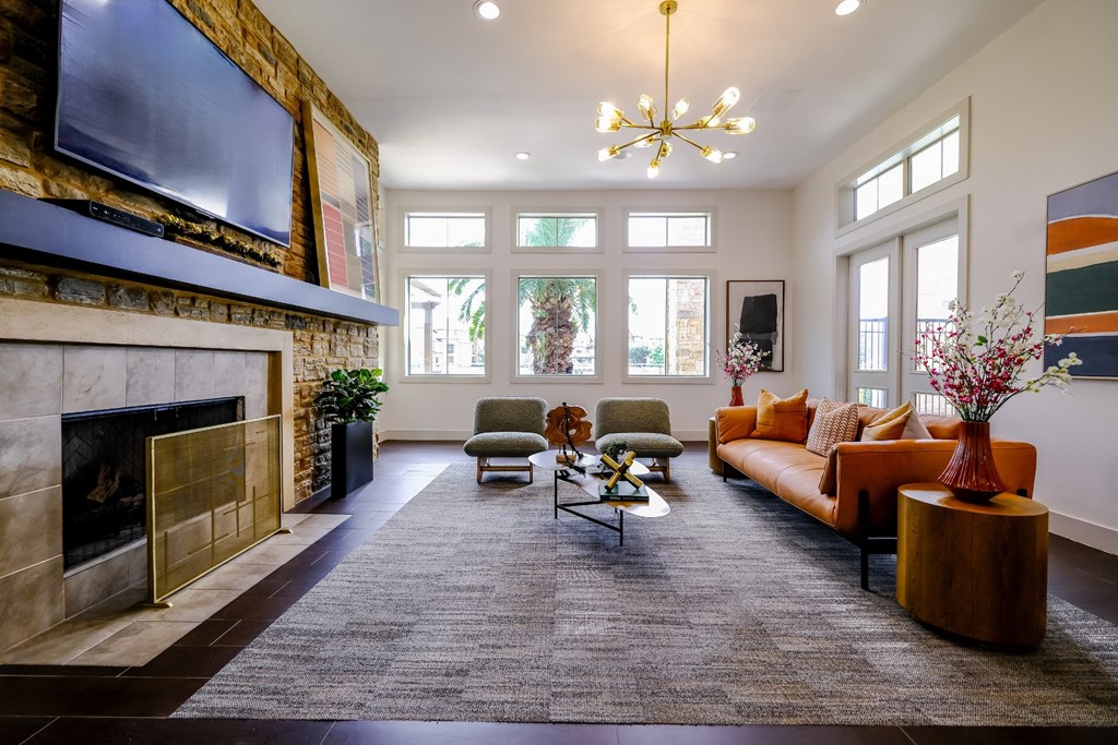social lounge with a fireplace at The Falls at Copper Lake apartments