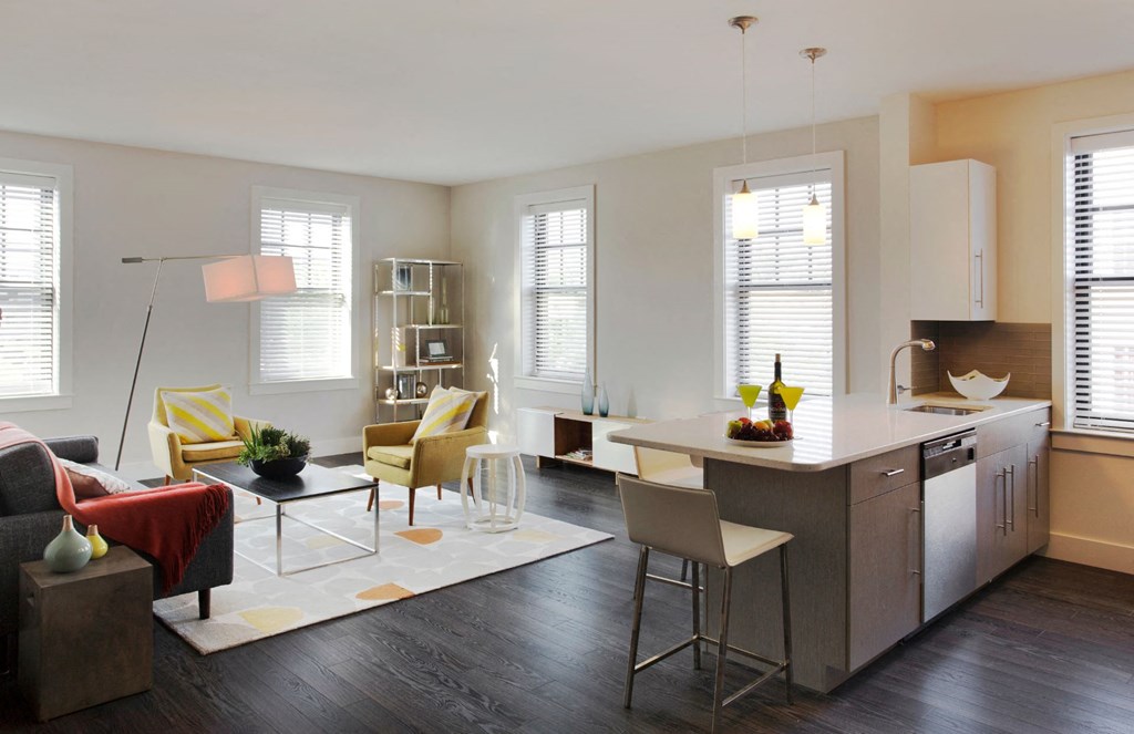Interior Kitchen with Prep Island and Open-Concept Living and Dining Area at Gatehouse 75, Charlestown, 02129