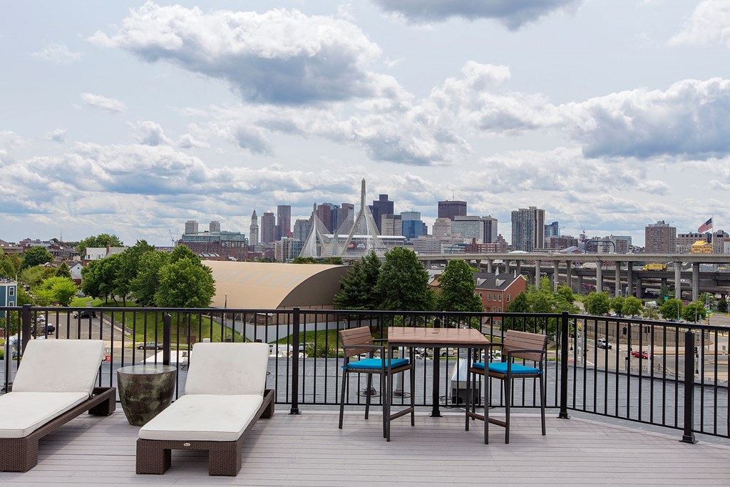 Rooftop Skydeck with Outdoor Living, Sundeck with Lounges and Spectacular Views of Boston Seaport and City Skyline at Gatehouse 75, Charlestown, Massachusetts