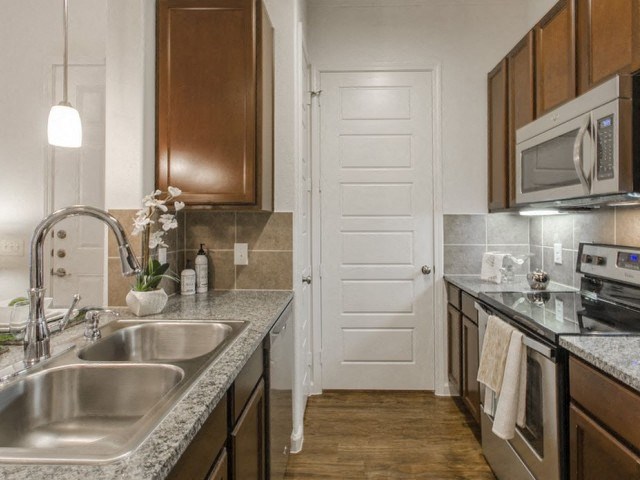 Fully Furnished Kitchen With Stainless Steel Appliances at Berkshire Jones Forest, Texas, 77384