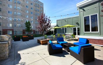 Outdoor Living Green Space with Firepit and Outdoor Movies--HighPoint Apartments Quincy MA