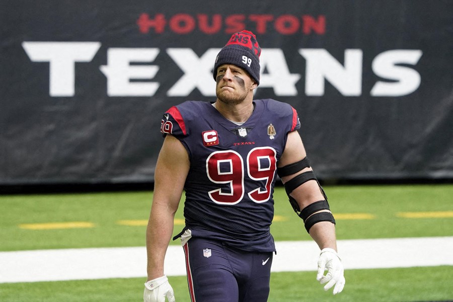 football player walks on the field before a game