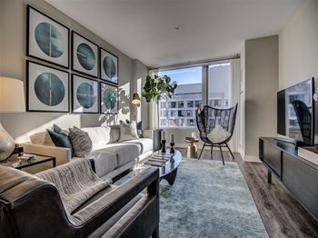 Living Room With Expansive Window at Via Seaport Residences, Boston, Massachusetts