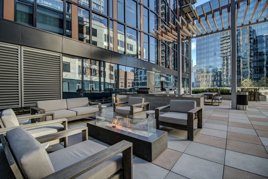 Outdoor courtyard with fire pit at Via Seaport Residences, Massachusetts