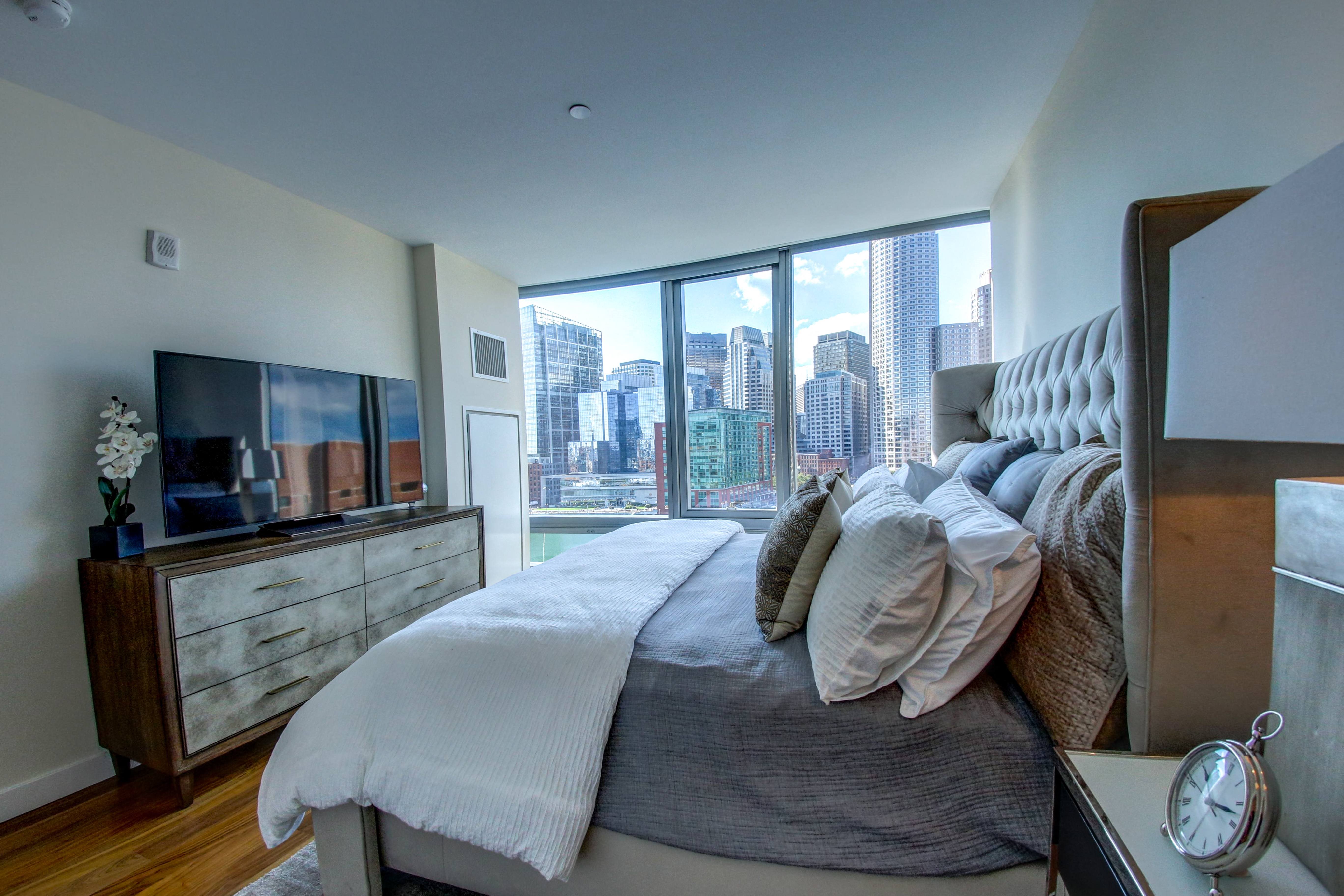 Interiors- The Benjamin Seaport Residences-Primary Bedroom with Waterfront View and En-Suite Bath