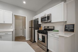 Kensington Grove apartments with with cabinets and stainless appliances