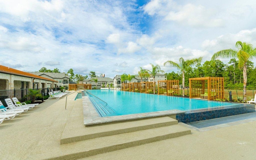 Relaxing Pool Area With Sundeck at Berkshire Woodland, Conroe, 77384