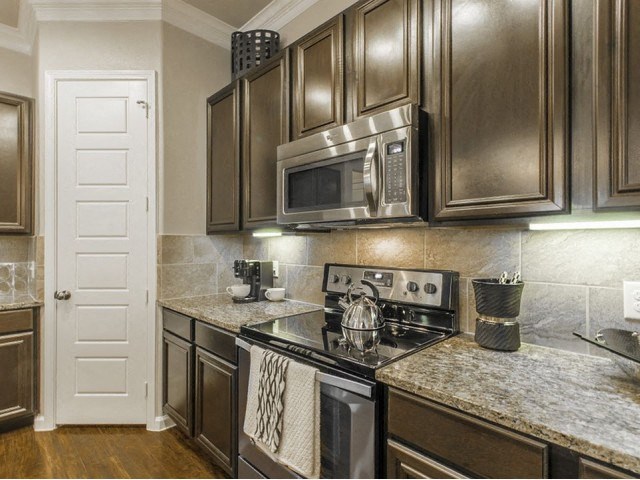 Kitchen With Ample Storage at Berkshire Woodland, Conroe, Texas