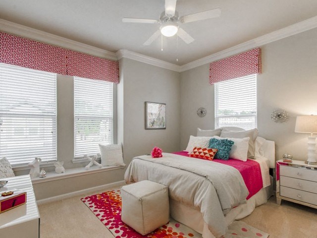 Bedroom With Expansive Windows at Berkshire Woodland, Conroe