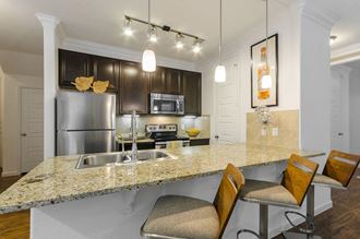 Fitted Kitchen With Island Dining at Berkshire Lakeway, Lakeway, TX, 78738
