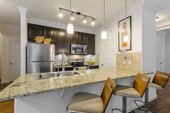 Fitted Kitchen With Island Dining Fitted Kitchen With Island Dining at Berkshire Lakeway, Lakeway, TX, 78738 - Photo Gallery 3