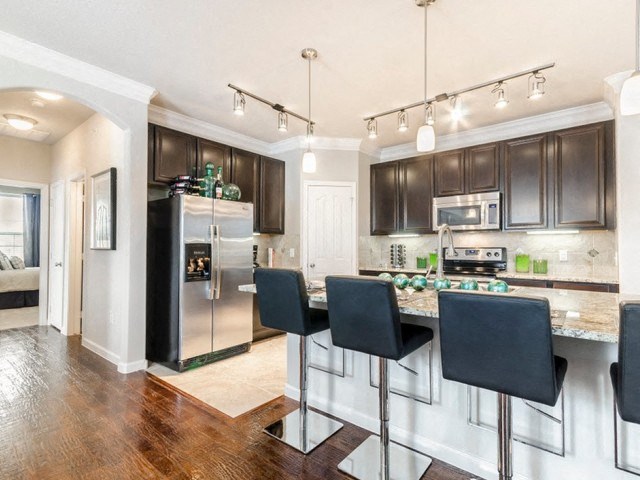 Fitted Kitchen With Island Dining at Villages of Briggs Ranch, San Antonio, 78245