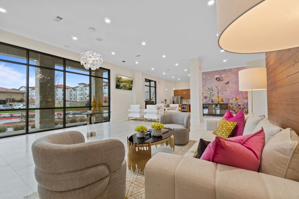 Living room with brown sofas at Reveal at Lake Ridge, Grand Prairie, 75054