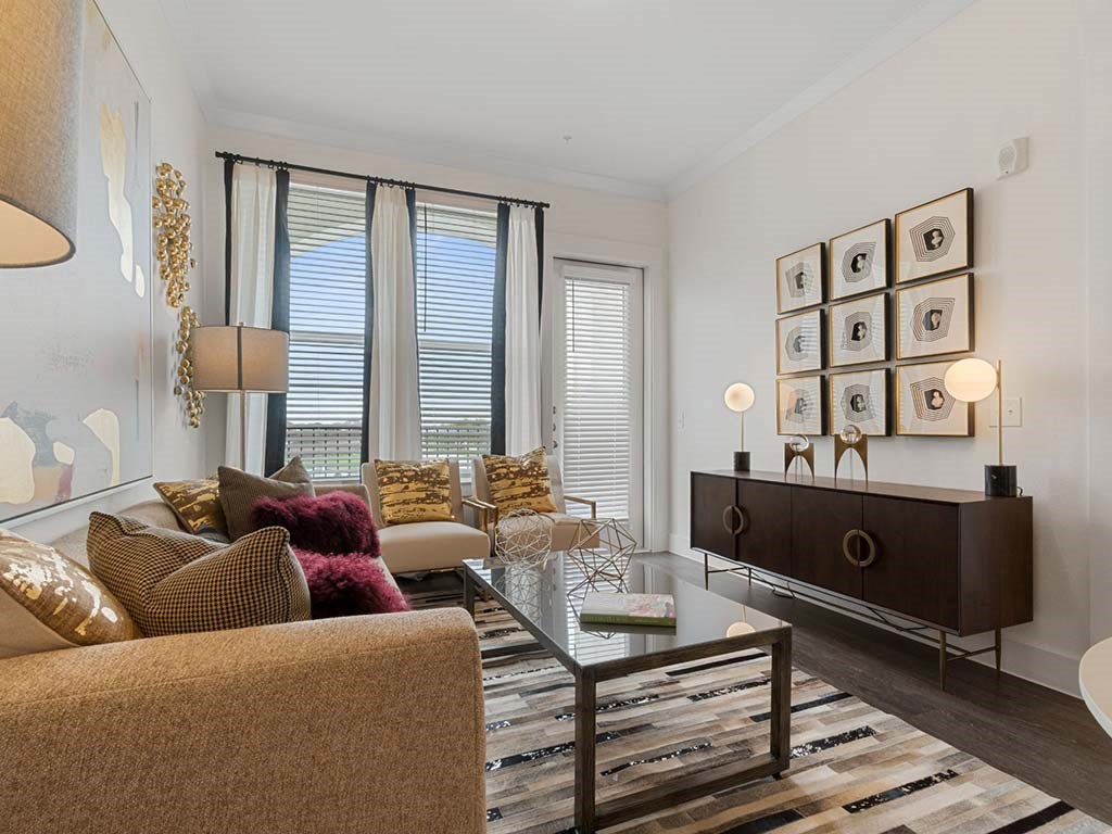 Living room with sofas at Reveal at  Lake Ridge, Grand Prairie