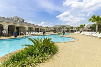 Swimming pool area view at Villages of Magnolia, Magnolia, Texas
