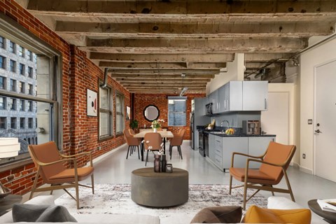 A modern kitchen with a dining table and chairs.