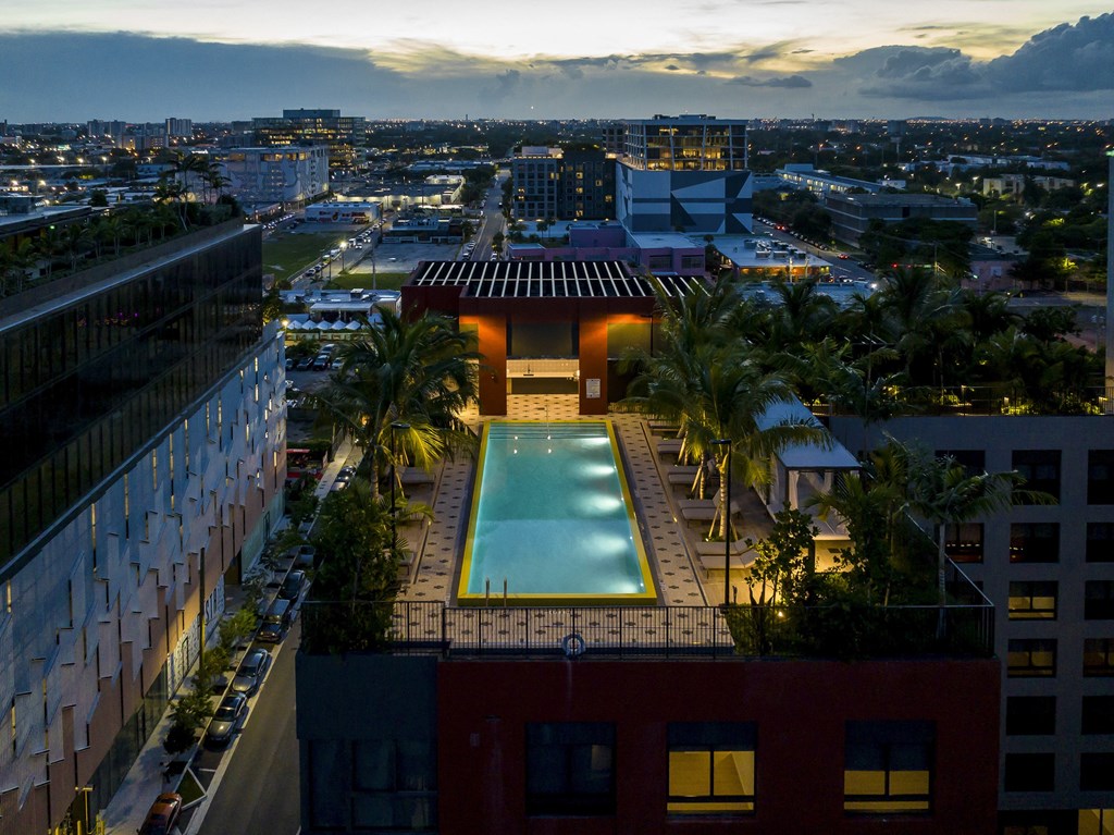 a city view of a rooftop swimming pool
