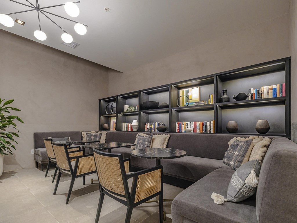 a social lounge with a couch and chairs and a table