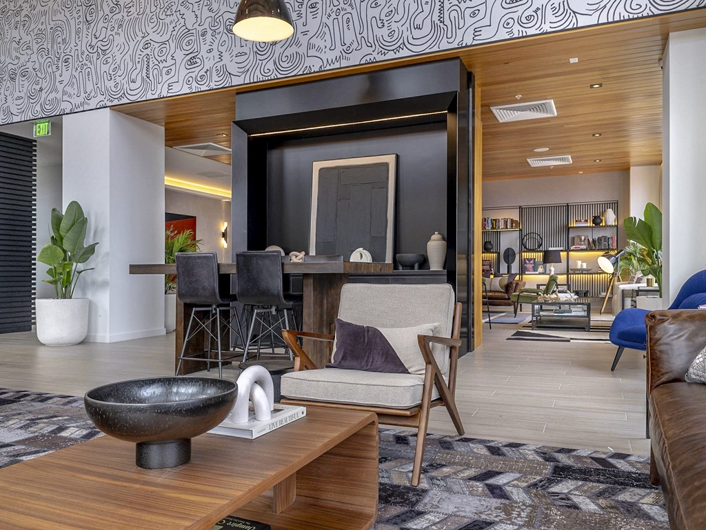 a social lounge with a table and comfortable seating