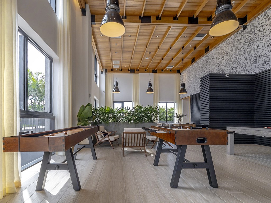 a game room with shuffleboard