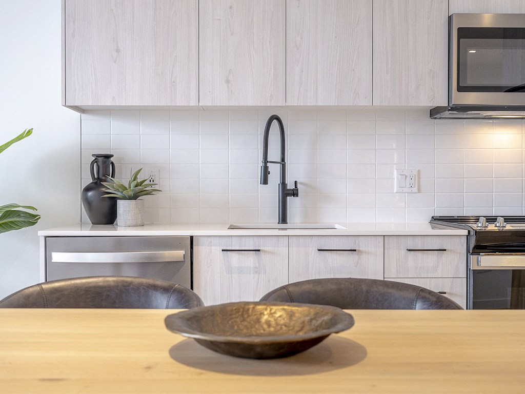 a kitchen with white cabinets