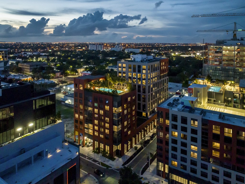 a view of 29 Wyn apartments at night from a high vantage point