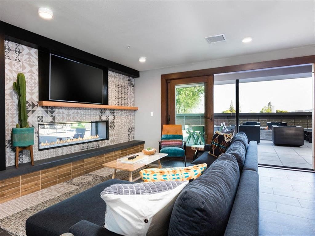 Resident clubhouse with flat screen tv at Cook Street Apartments, Portland, OR 97227
