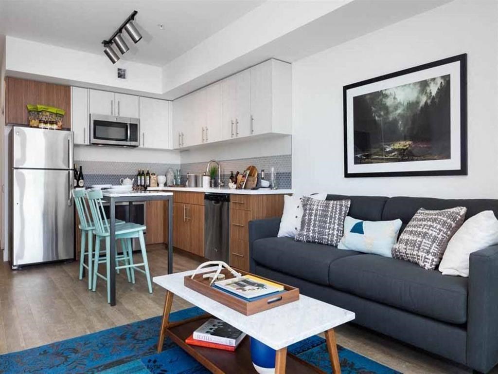 Interior apartment view of kitchen from living room at Cook Street Apartments, Portland, OR 97227