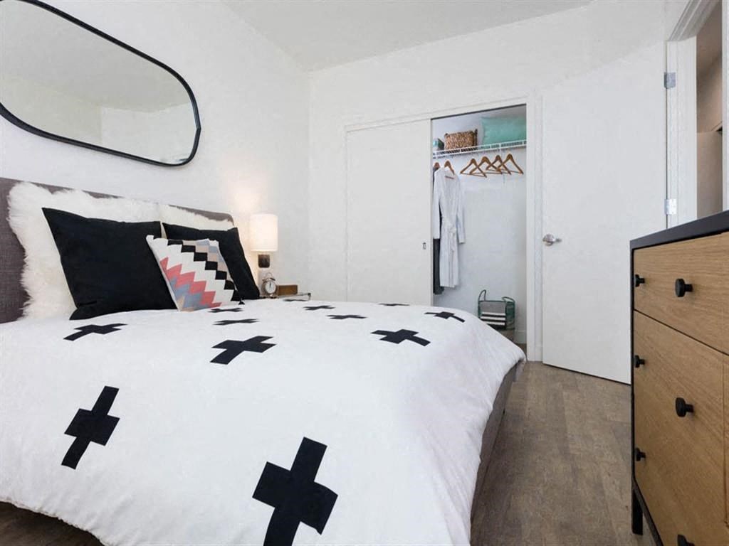 Spacious bedroom with large closet at Cook Street Apartments, Portland, OR 97227