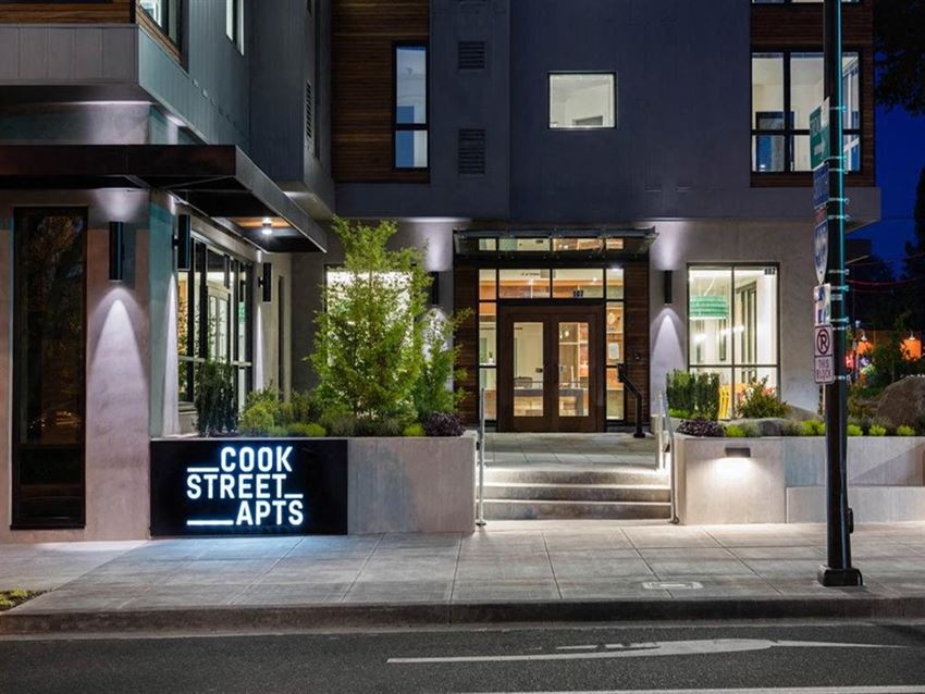 Exteriors Front entrance at night at Cook Street Apartments, Portland
