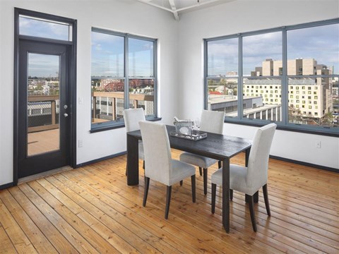 A dining room with a view of the city.