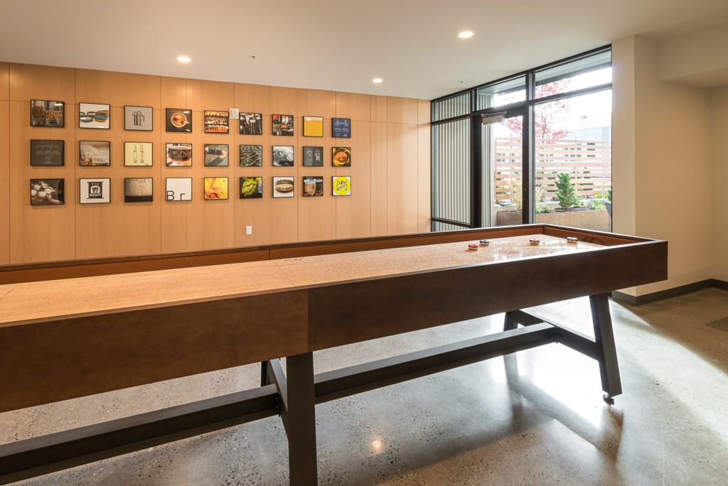 social area with shuffle board at Peloton apartments