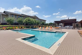 Swimming Pool with Lounge Seating at The Pradera, Richardson, TX