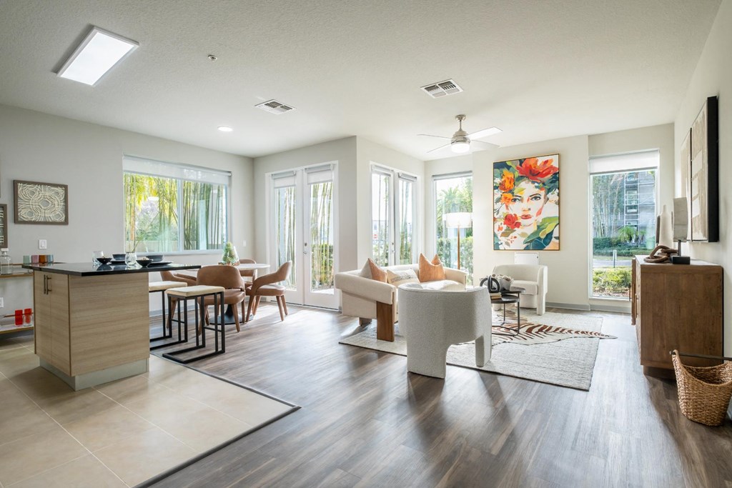 Reveal Heathrow apartments spacious living area with floor to ceiling windows