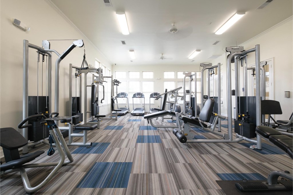 gym with cardio equipment at Retreat at Magnolia apartments