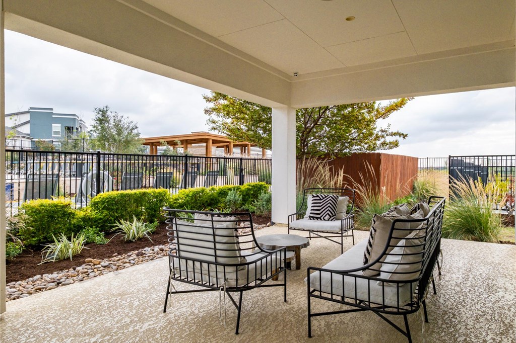 Covered Outdoor Social Lounging Space at Reveal 54 Apartments