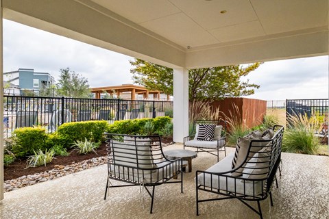 Covered Outdoor Social Lounging Space at Reveal 54 Apartments