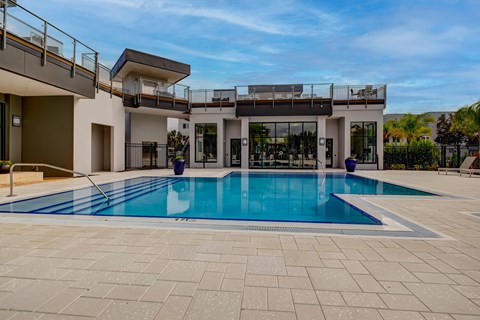 A modern house with a swimming pool in the backyard.