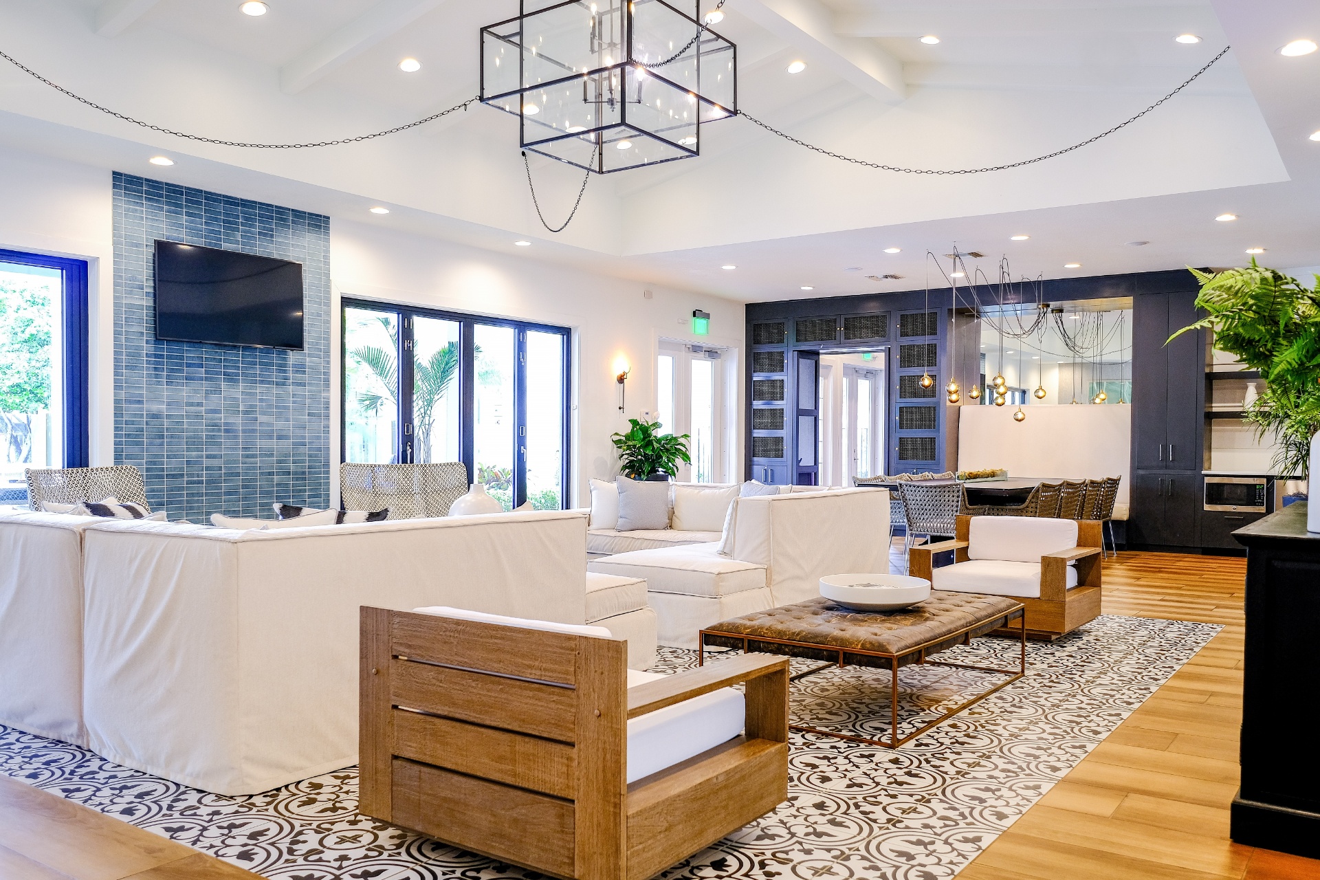 A modern living room with a white sofa and a wooden coffee table.
