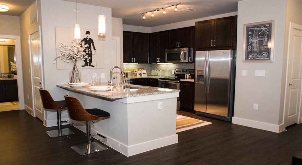 Espresso Cabinets with Tiled Backsplash Interiors at Berkshire Amber, Dallas, TX